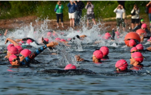 Leah Holzwarth and others participating in an annual 2.1-mile open water swim in Lake Superior