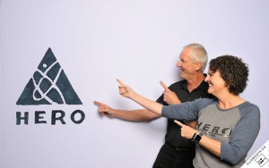 Paul Terry and Karen Moseley point to HERO logo